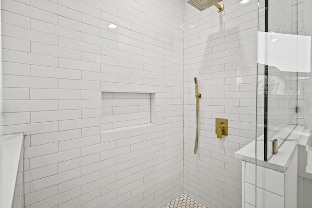 bathroom featuring a shower with shower door