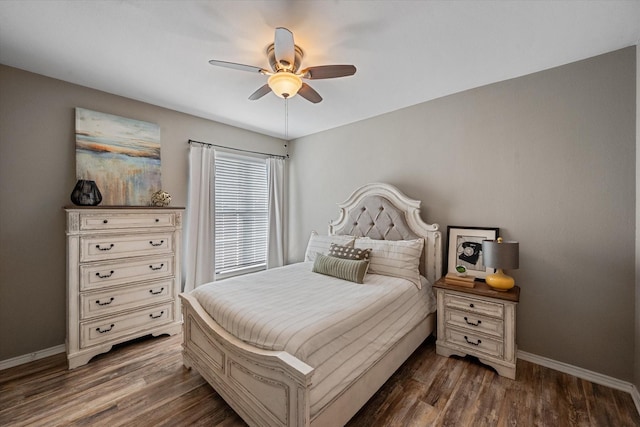 bedroom featuring dark hardwood / wood-style floors and ceiling fan