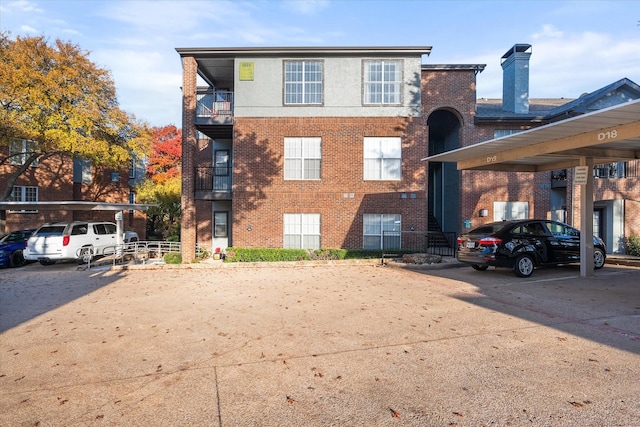 exterior space featuring a carport