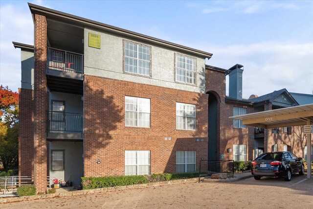 1654 Ascension Bluff Dr Unit 335, Arlington, TX 76006 - view of building exterior with covered parking