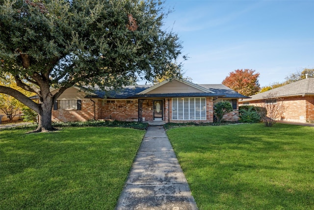 ranch-style house with a front lawn