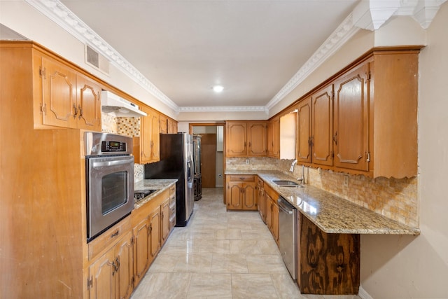 kitchen with light stone countertops, stainless steel appliances, premium range hood, crown molding, and decorative backsplash