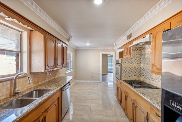 kitchen featuring decorative backsplash, sink, stainless steel appliances, and extractor fan