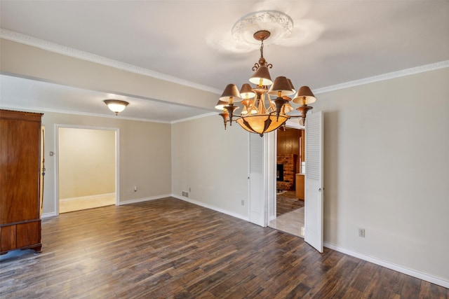 unfurnished room with a fireplace, dark hardwood / wood-style flooring, and ornamental molding