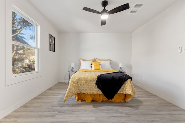 bedroom featuring ceiling fan and light wood-type flooring