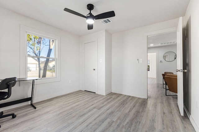 office space featuring light wood-type flooring and ceiling fan