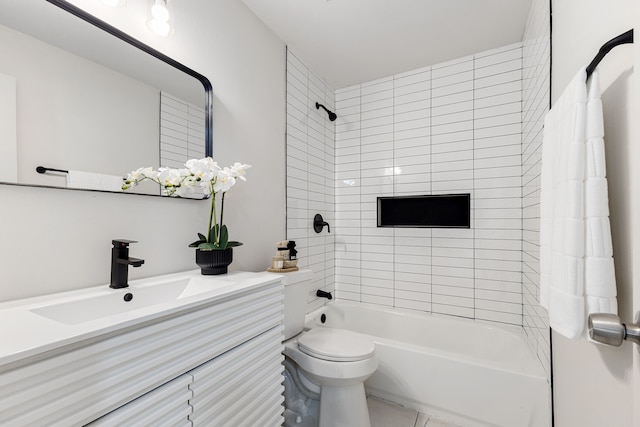 full bathroom with vanity, toilet, and tiled shower / bath