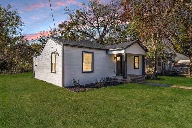 view of front of home with a yard