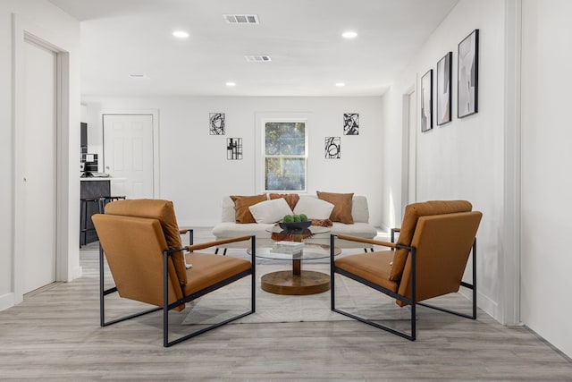 sitting room featuring light hardwood / wood-style floors