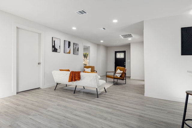 living area with light hardwood / wood-style flooring