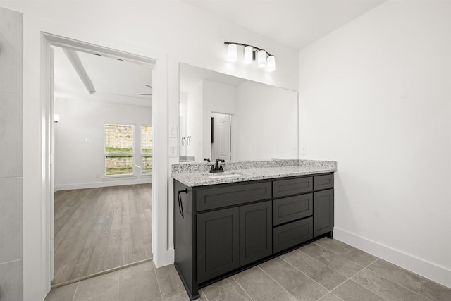 bathroom with tile patterned floors and vanity