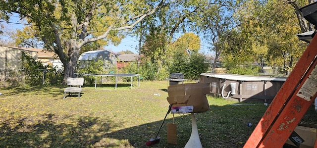 view of yard featuring a trampoline