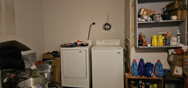 clothes washing area featuring separate washer and dryer