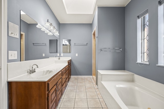 full bath with tile patterned flooring, crown molding, a garden tub, double vanity, and a sink