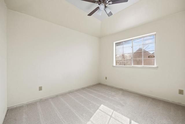 carpeted empty room featuring a ceiling fan