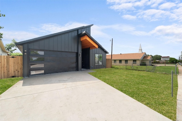 view of front of home with a garage and a front yard