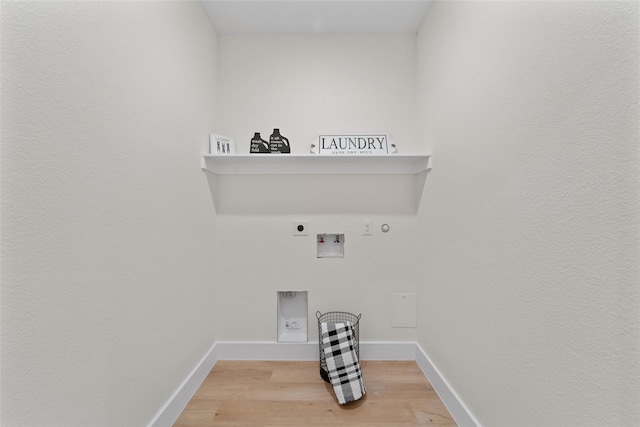 laundry area featuring hookup for an electric dryer, hardwood / wood-style floors, hookup for a gas dryer, and hookup for a washing machine