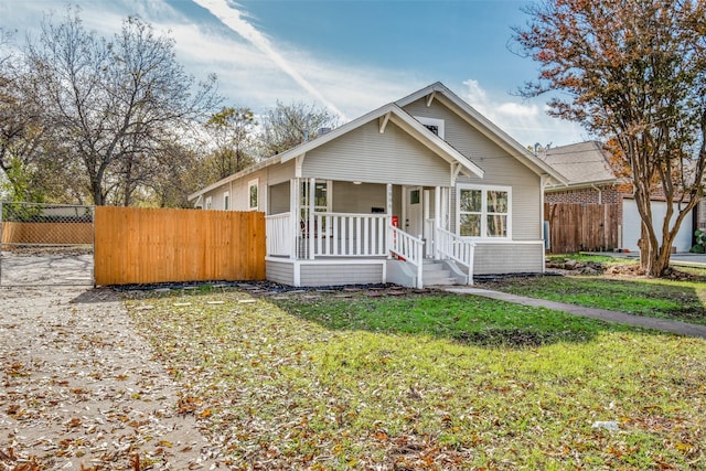 view of front of house featuring a front lawn and a porch