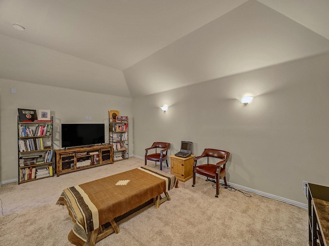 living room with vaulted ceiling and carpet flooring