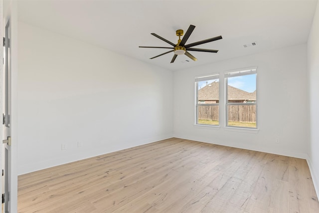 spare room featuring ceiling fan and light hardwood / wood-style floors