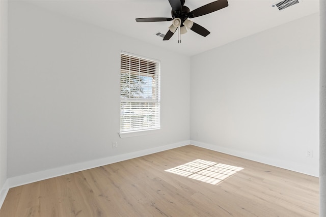 empty room with ceiling fan and light wood-type flooring