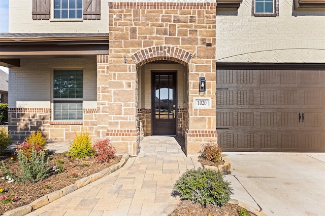 view of exterior entry featuring a garage