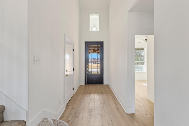 entrance foyer featuring light hardwood / wood-style flooring and ceiling fan