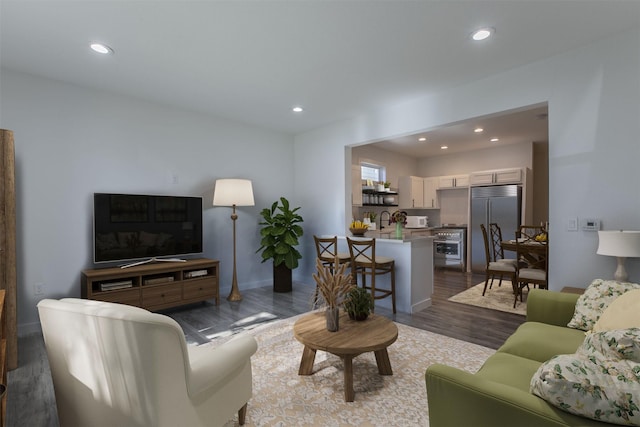 living room with dark hardwood / wood-style floors and sink