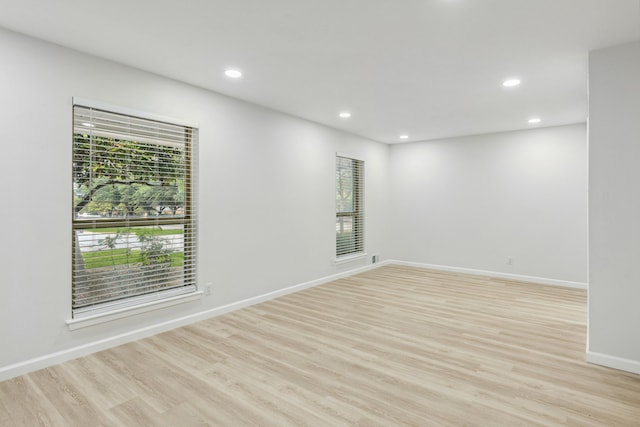 unfurnished room featuring light wood-type flooring