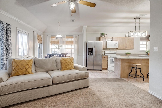 living room featuring light colored carpet, vaulted ceiling, ceiling fan, and ornamental molding