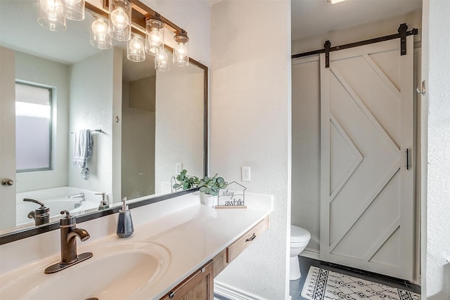 bathroom with tile patterned floors, vanity, and toilet