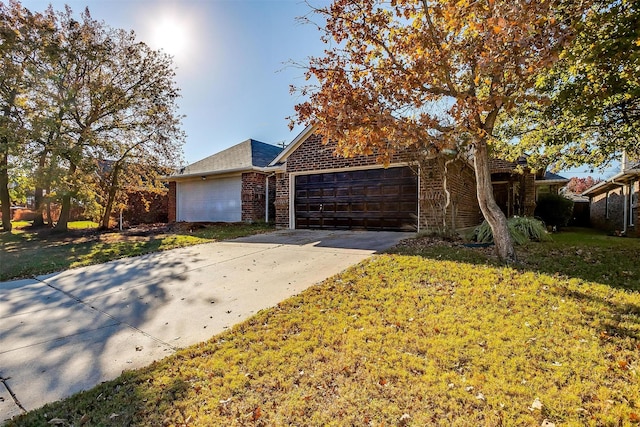 view of front property with a front yard and a garage