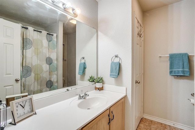 bathroom featuring tile patterned floors and vanity