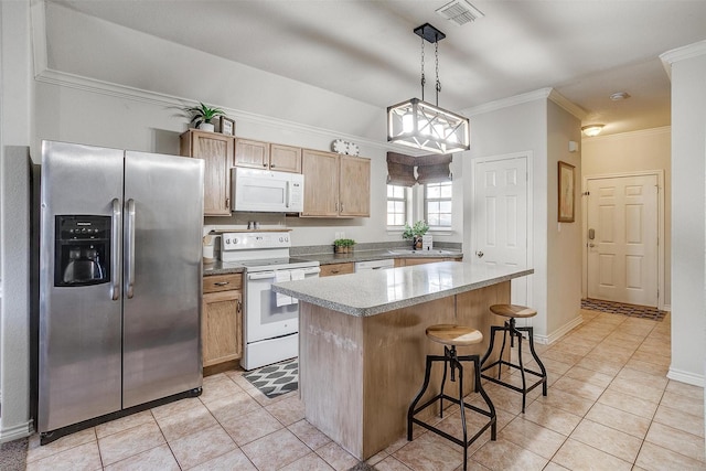 kitchen with a kitchen island, decorative light fixtures, white appliances, light tile patterned floors, and ornamental molding