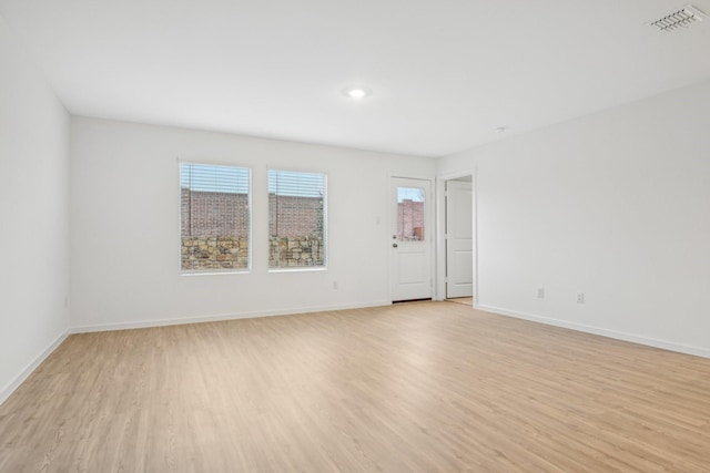 spare room featuring light hardwood / wood-style flooring