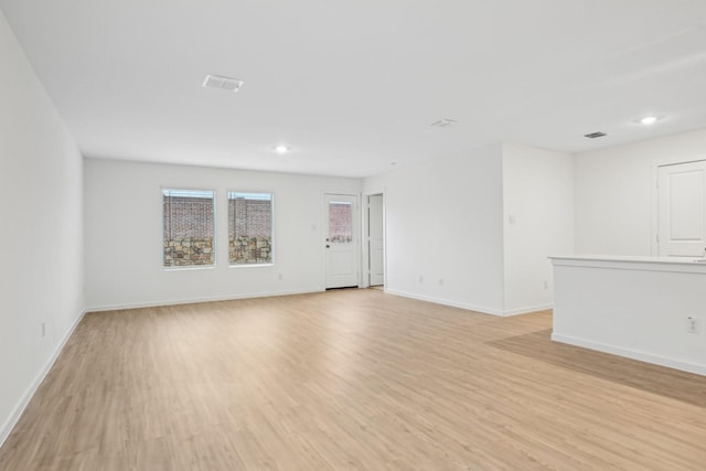 spare room with light wood-type flooring