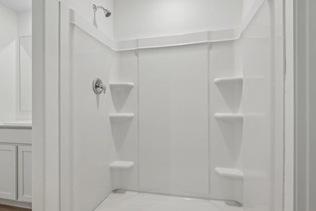 bathroom featuring vanity and walk in shower