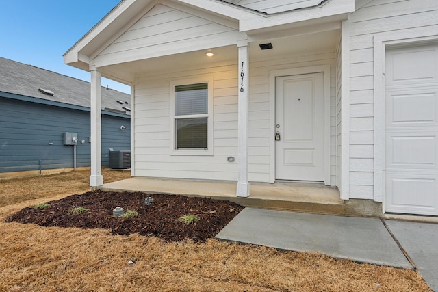 property entrance with a porch and central AC