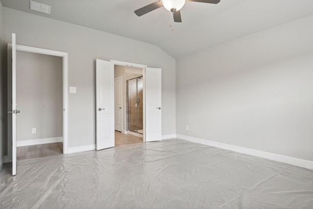 unfurnished bedroom featuring light carpet, ceiling fan, and lofted ceiling