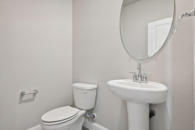 bathroom featuring toilet