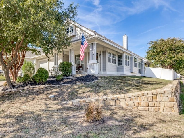 view of front facade featuring a porch and a garage