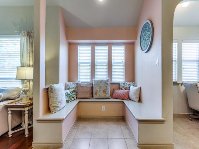 living area featuring light tile patterned floors and breakfast area