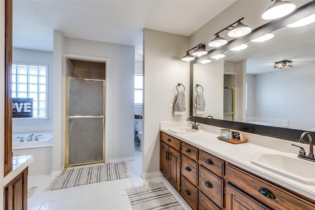 full bathroom featuring vanity, tile patterned flooring, plus walk in shower, and toilet