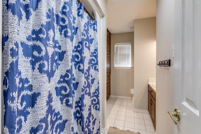 bathroom featuring tile patterned flooring, vanity, toilet, and a shower with curtain