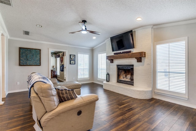 living room with plenty of natural light and dark wood-type flooring