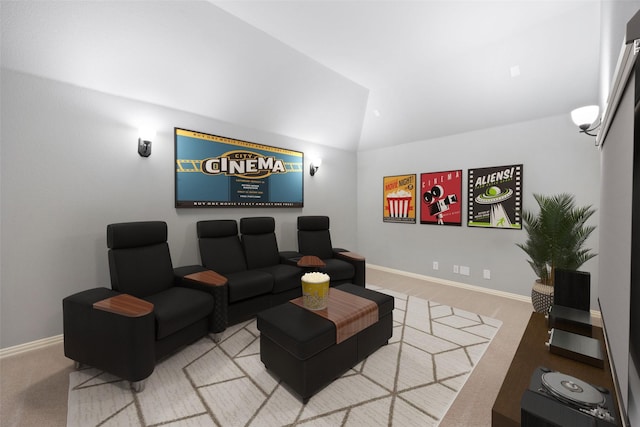 cinema room featuring carpet flooring and vaulted ceiling