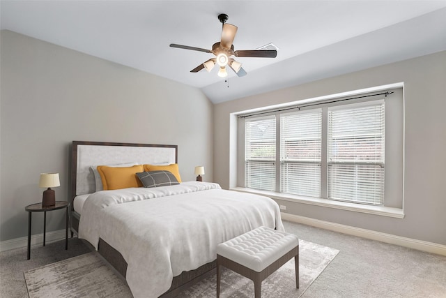 carpeted bedroom with ceiling fan and lofted ceiling