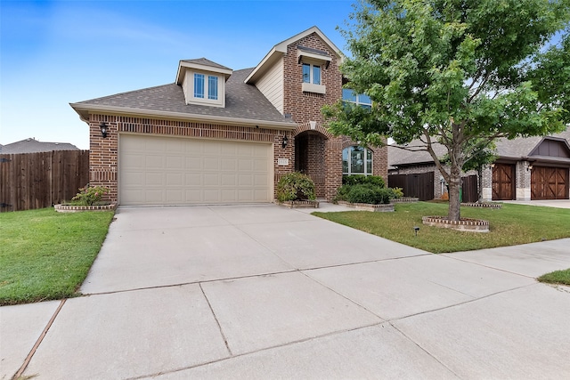 view of front facade with a garage and a front lawn