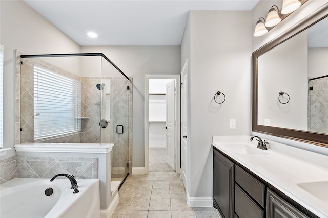 bathroom featuring tile patterned flooring, shower with separate bathtub, and vanity