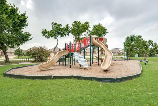 view of playground with a lawn